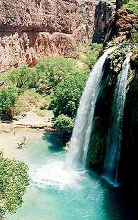  Plunging 200 feet into the swimming hole below, Mooney Falls is the most majestic of the three waterfalls in the Havasupai Indian Reservation..