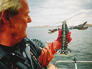 Lobsterman with his catch off of Tierra del Fuego