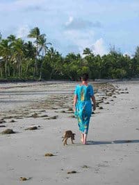 The author walking the beach in Pangani Tanzania with her dog. photos by John Parkin and Terry Harnwell.