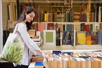 Shopping for travel guides in a bookstore.