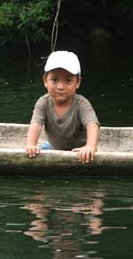 Mayan Boy in Dugout on Rio Tatin