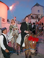 They took their vows beneath the magnificent Santorini sunset.