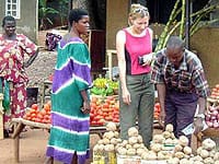 The author shops for vegetables in Kampala.