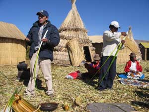 The author's guide Pepe explains how houses and boats are constructed from reeds by the Amayra.