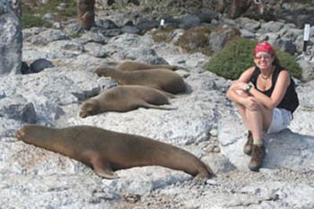 Lisa Lubin relaxes with sea lions on the Galapagos Islands