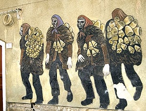 A painting of the Mamuthones on the wall of a house in Mamoiado