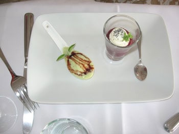 Coquille St. Jacques foamed in a single serving spoon with a shooter of farm cheese floating on a puree of sweet beet mousse