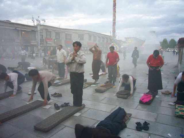 Daily prayers in front of the Jokhang Temple, Lhasa.