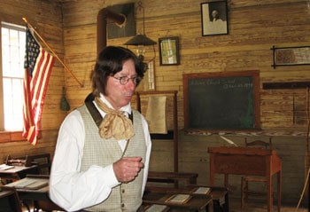 The Schoolteacher in Old Alabama Town will tell you all about how he conducts his classes.