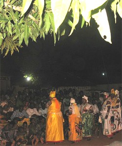 Voodooshi and Chief's spouses arrive at a family's Voodoo Ceremony in Benin.