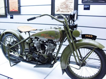 A vintage motorcycle on display at the Harley Davidson Museum