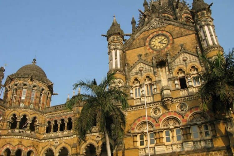 The Royal Palms from Cuba flank the clocktower at Chhatrapati Shivaji Terminus, formerly Victoria Terminus.