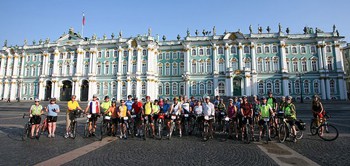 Tour d' Afrique cyclists outside of Winter Palace in St. Petersburg, the start of the Amber Route. Photo by Paul McManus.