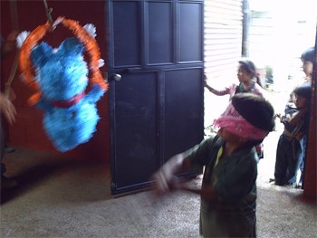 Celebrating the completed house in Guatemala with a pinata party.