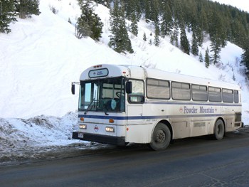 Do it by bus! Powder Mountain's ski bus takes skiiers all the way to the top 9600 feet, at Snowbasin.