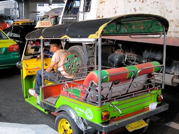 A tuk-tuk waits in a traffic jam in Bangkok.