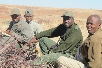 Rhino trackers in Namibia. Desert land