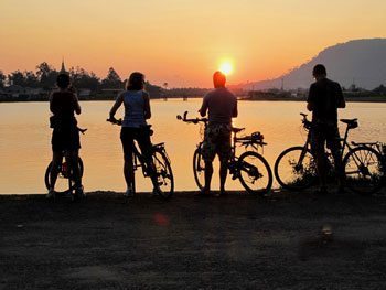 Cyclists enjoying the Cambodian sunset