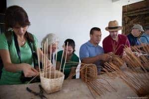 Weaving baskets of bamboo, part of the coffee plantation experience.