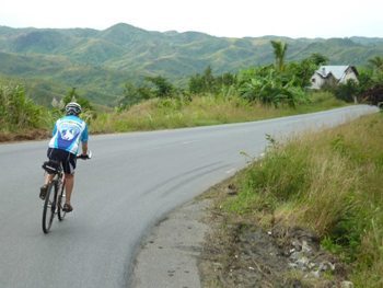 Biking down a curvy road in Madagascar.