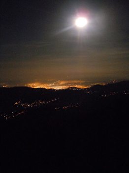 The lights of Kingston from the mountains during a moonlight hike.