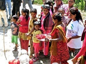 Villagers blessing the building.