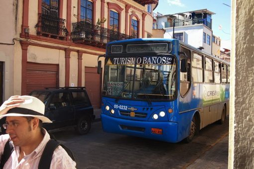 In Cuenca, the buses come very close to the people on the sidewalks. Soon a tram will replace many of these diesel buses. 