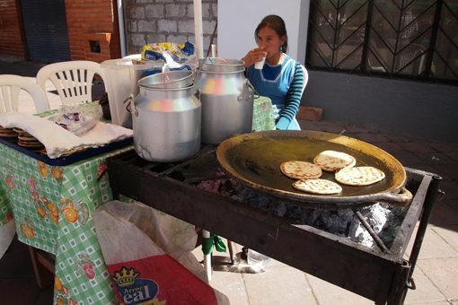 Corn cakes hot on a griddle, a specialty of the country near Quito.