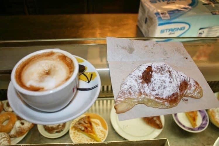 Cornetto and cappuccino: Breakfast in Rome.