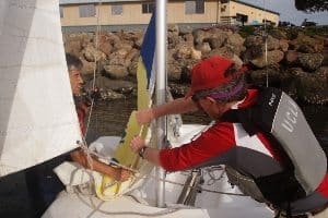Cesar rigging the sails.