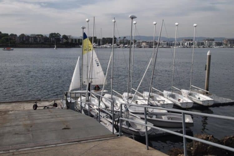 Sailboats await at the UCLA Sailing Center in Marina del Rey, California.