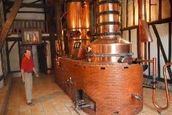 Max Dumolier, grower, of Ch Sandemagan with his stills.