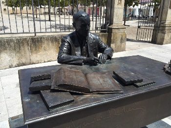 A bronze statue of a famous local author in Viseu. Max Hartshorne photo.