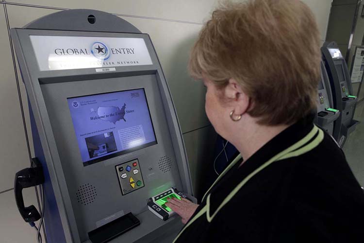 Using the Global Entry kiosk at a US Airport. Find what your global entry application status is by logging into their website.