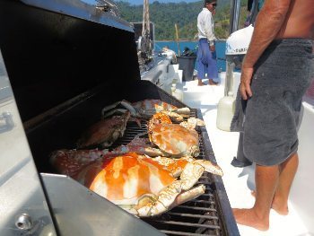 Grilling crabs for lunch, a lucky trade with local fisherman for a few cans of cold drinks.