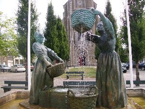 Women's memorial statue at Cancale cathedral and park.
