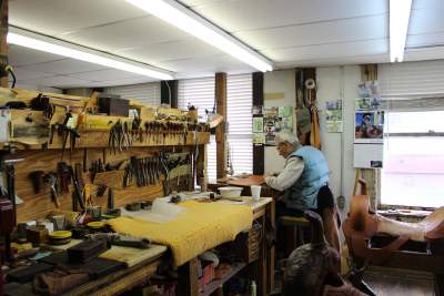 A man working on a saddle at M.L. Leddy's. Stephanie DiCarlo photos.