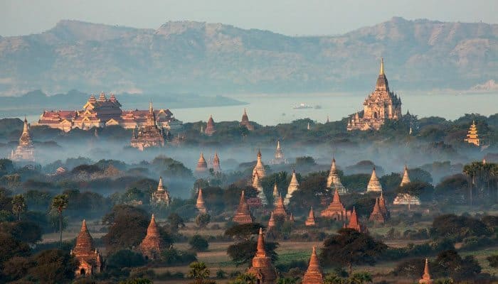 Pagodas rise above the landscape seen while cruising through Myanmar 