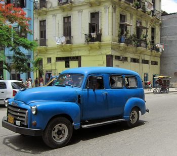 An old van drives the streets of Havana, Cuba.
