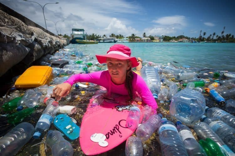 Alison displays her dissaproval at all of the plastic bottles in the water.