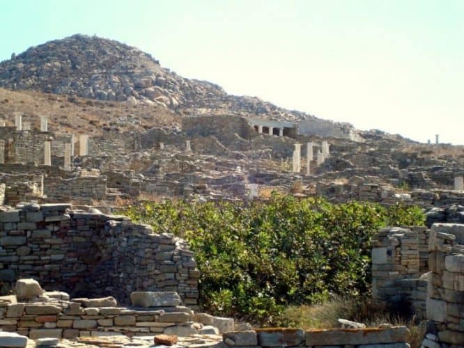 Ancient pillars and temple facades on Mount Kynthos in Delos.