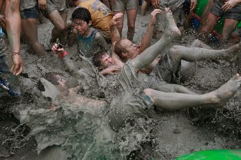 Wrestling in the mud that's trucked up from a nearby pit to the beach.