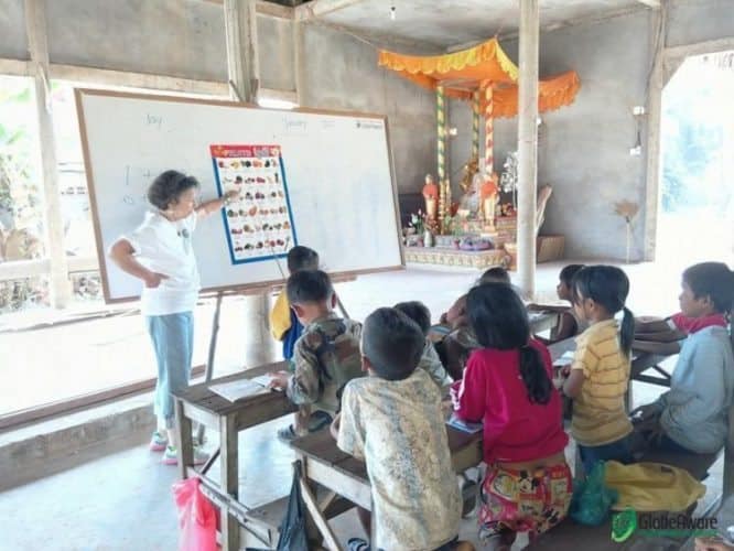 A volunteer teaches in Cambodia.