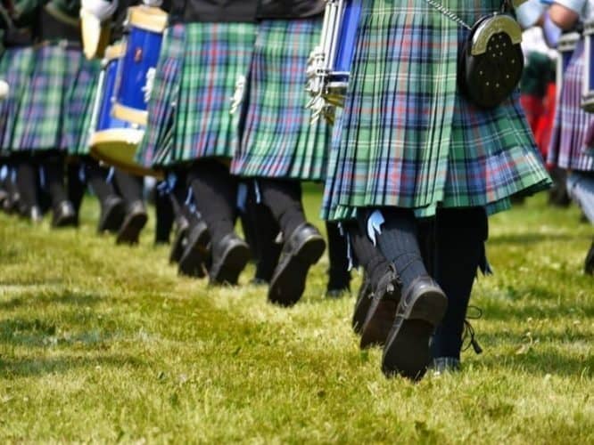 Pipe bands dressed in kilts with matching socks, and 'sporrans' or pouches worn at the waist.