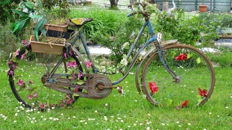 An old bike with flowers. A perfect yard adornment.