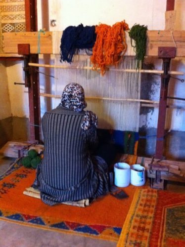 Weaving on a loom in Morocco.