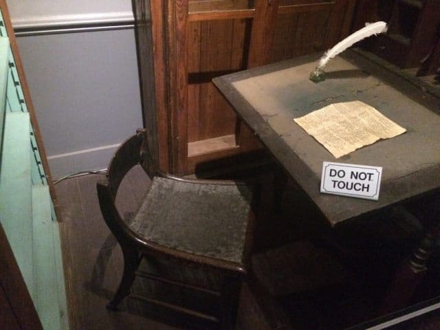 Edgar Allan Poe's writing desk and chair on display in Richmond, VA's Poe Museum. 