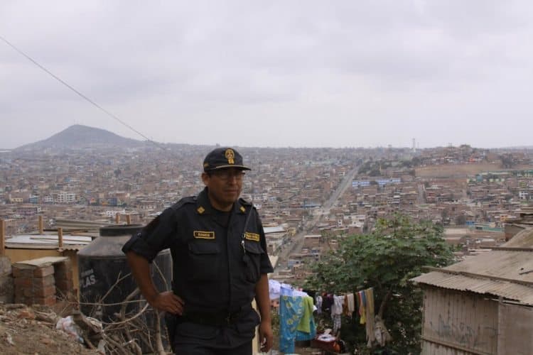 A policeman is required, 'to keep travelers from stealing kids,' in the poorest cities in Peru. 