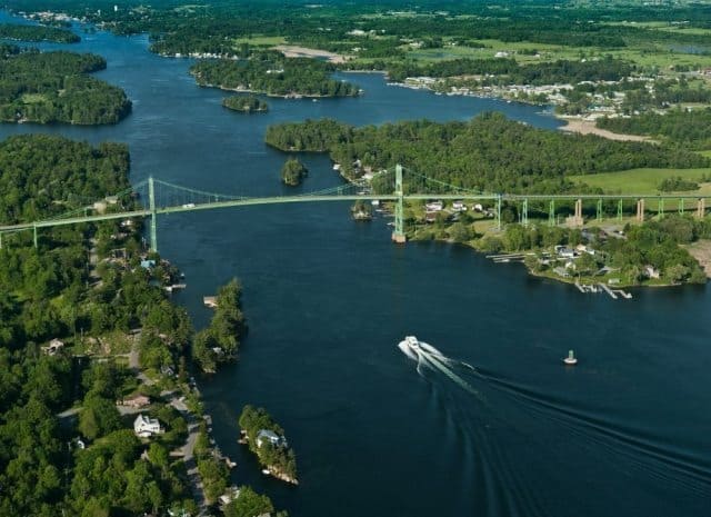 The bridge over the St. Lawrence River connecting Northern NY and Ontario, Canada. Thousand Islands International Tourism County Photos.