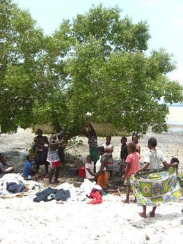 Locals buy clothes at a makeshift bazaar.